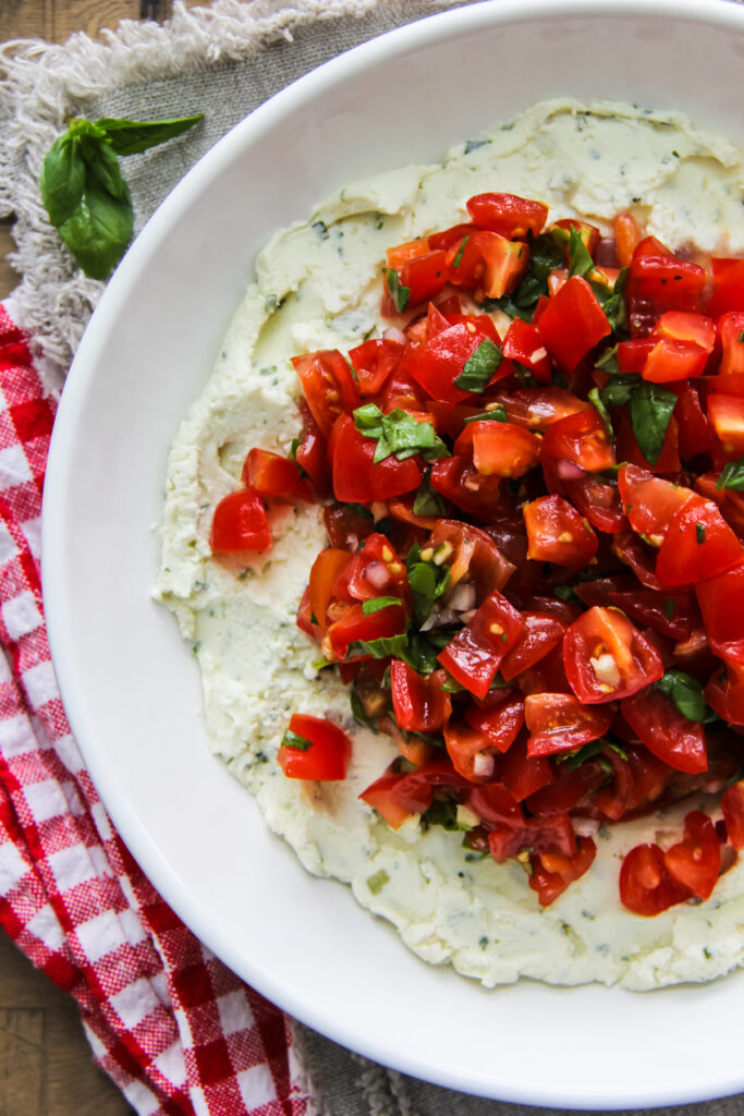 a serving bowl of Boursin bruschetta dip