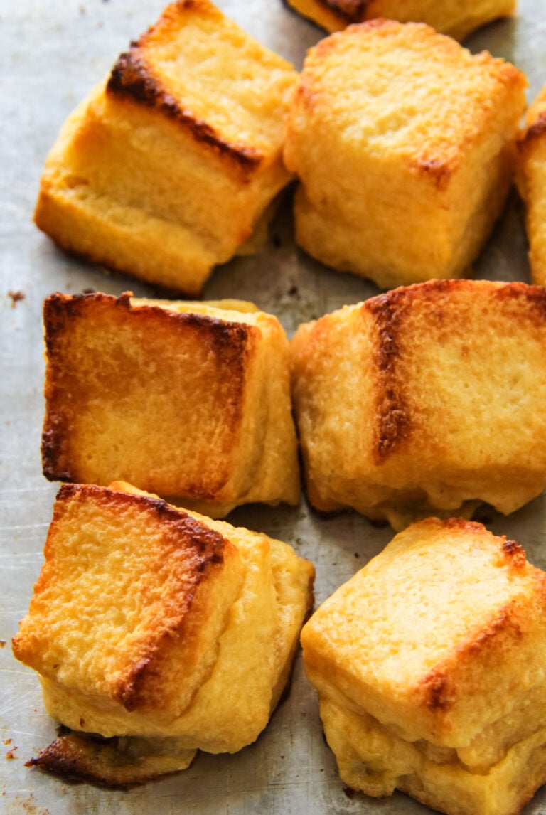 baked cheese puffs on a baking sheet