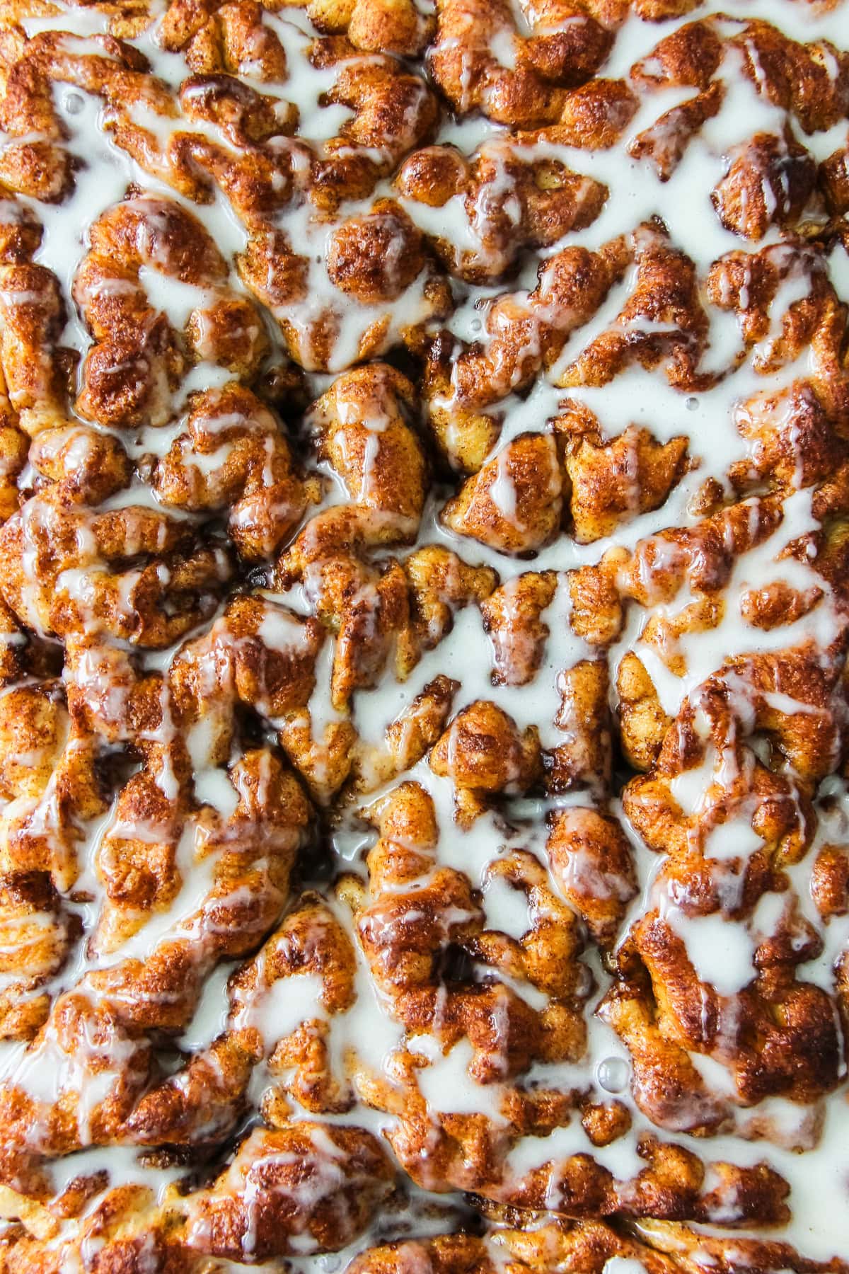 cinnamon roll focaccia with sugar glaze drizzle