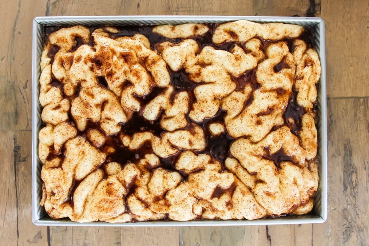 unbaked cinnamon roll focaccia in a baking pan