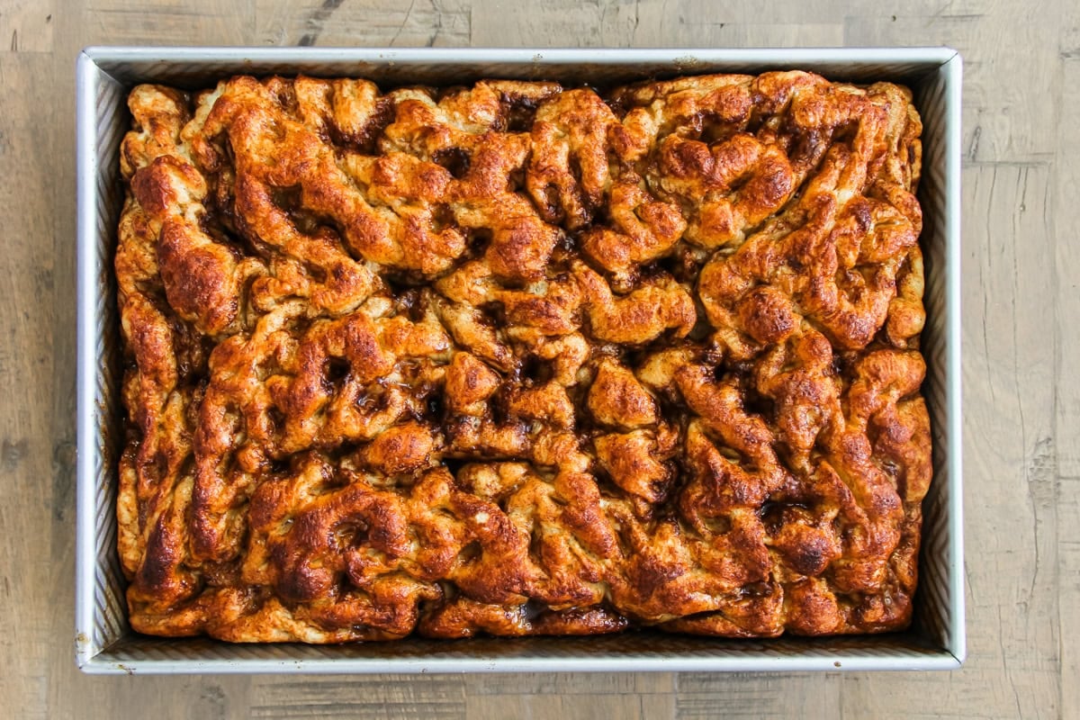 cinnamon roll focaccia in a baking pan