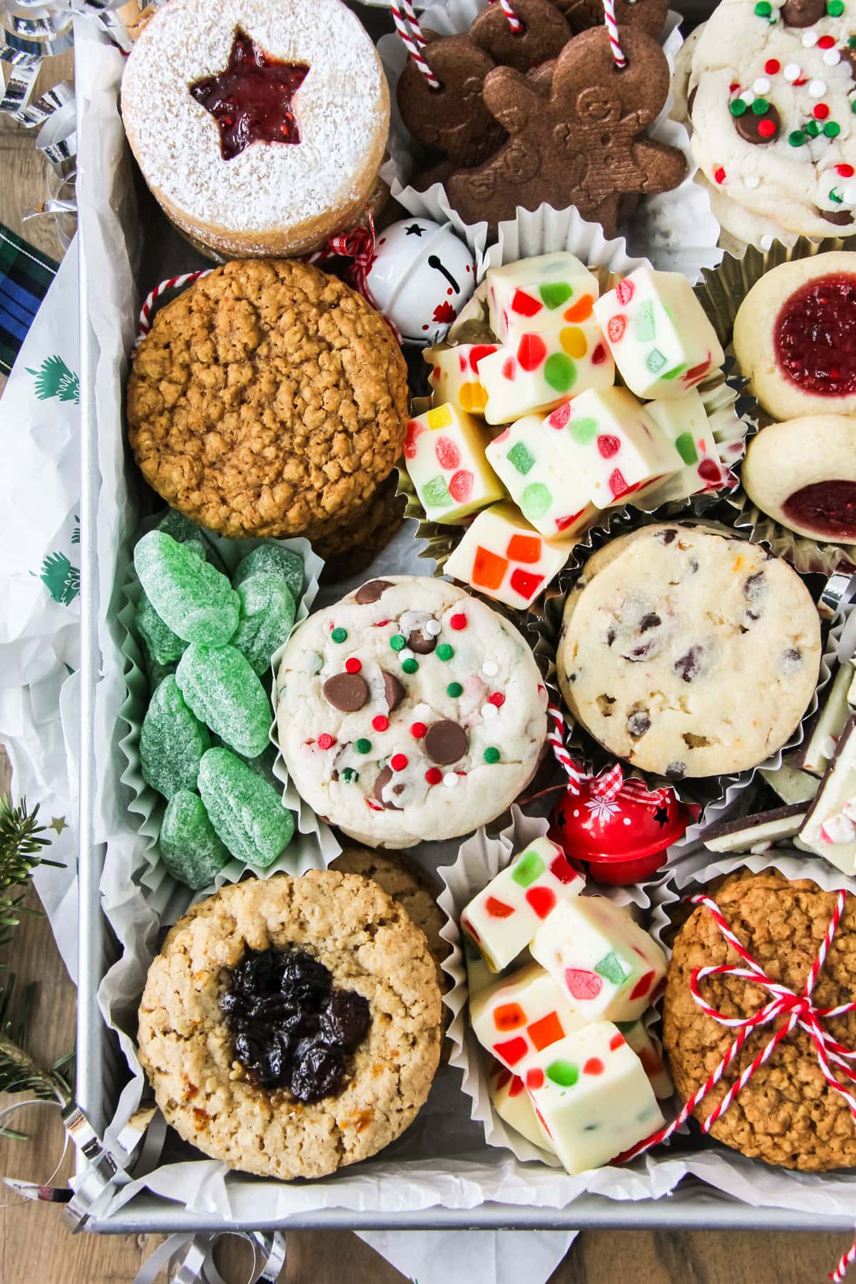 a cookie box loaded up with festive cookies and treats