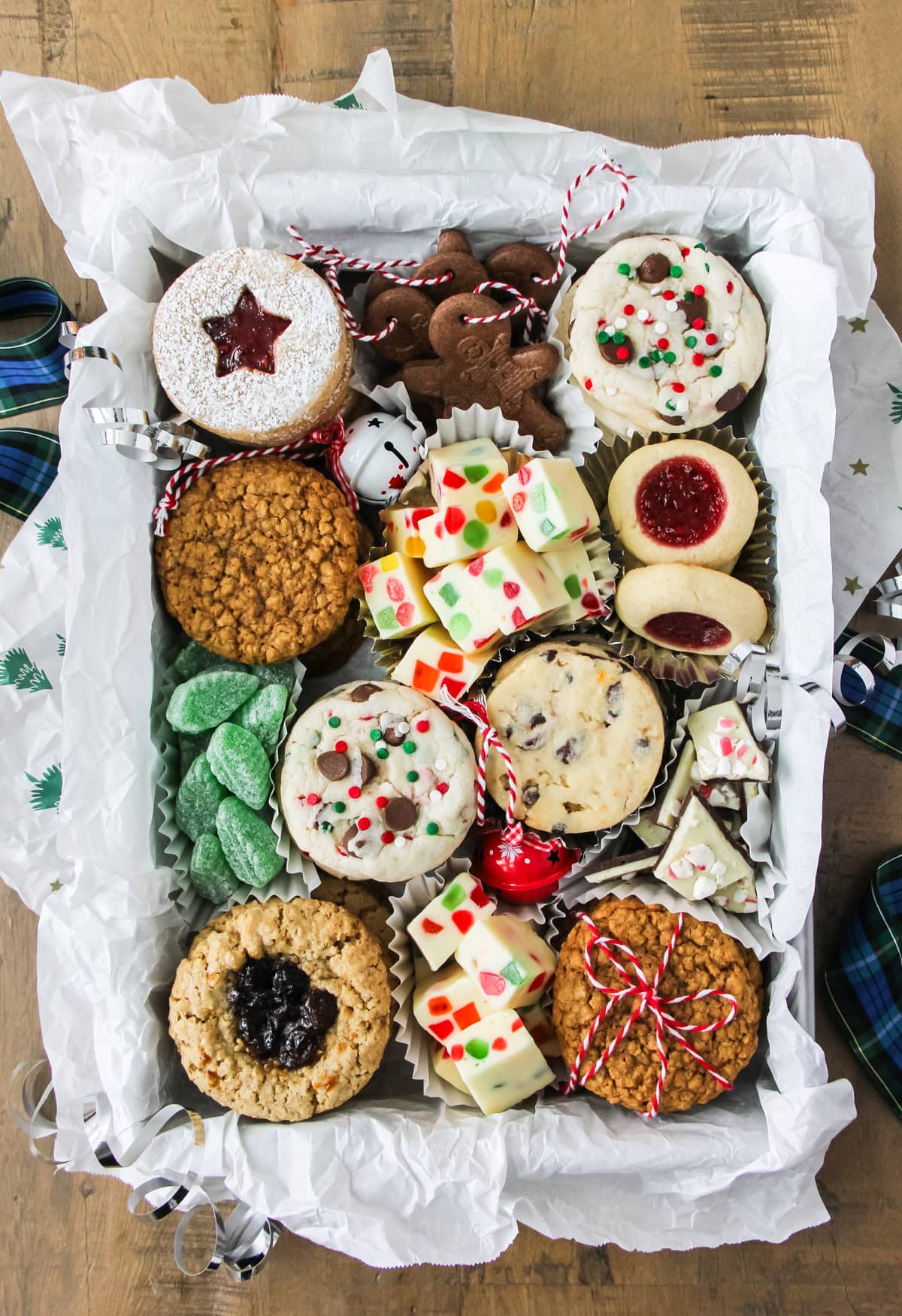 a cookie box loaded up with festive cookies and treats