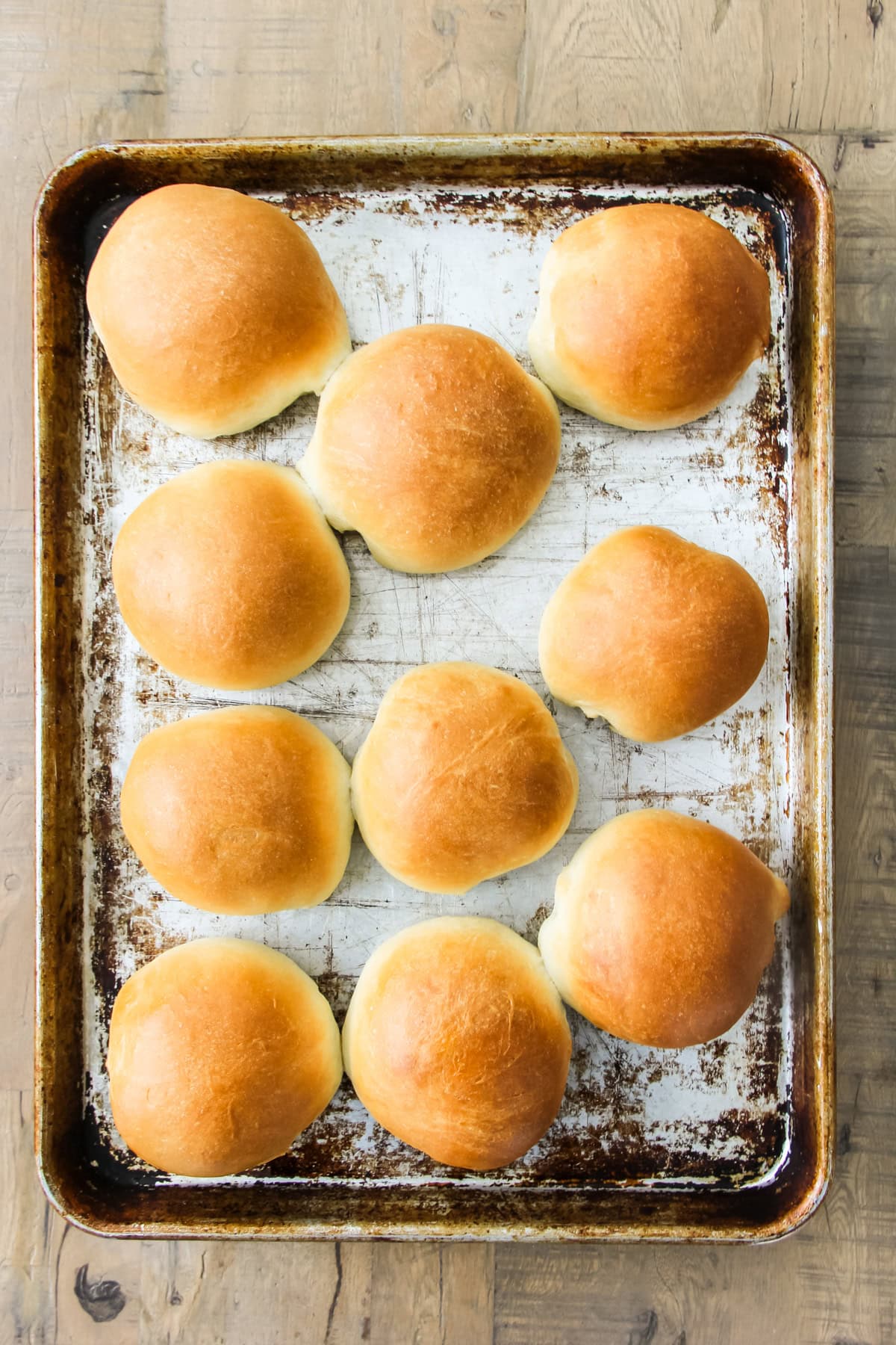 a baking sheet with homemade hamburger buns