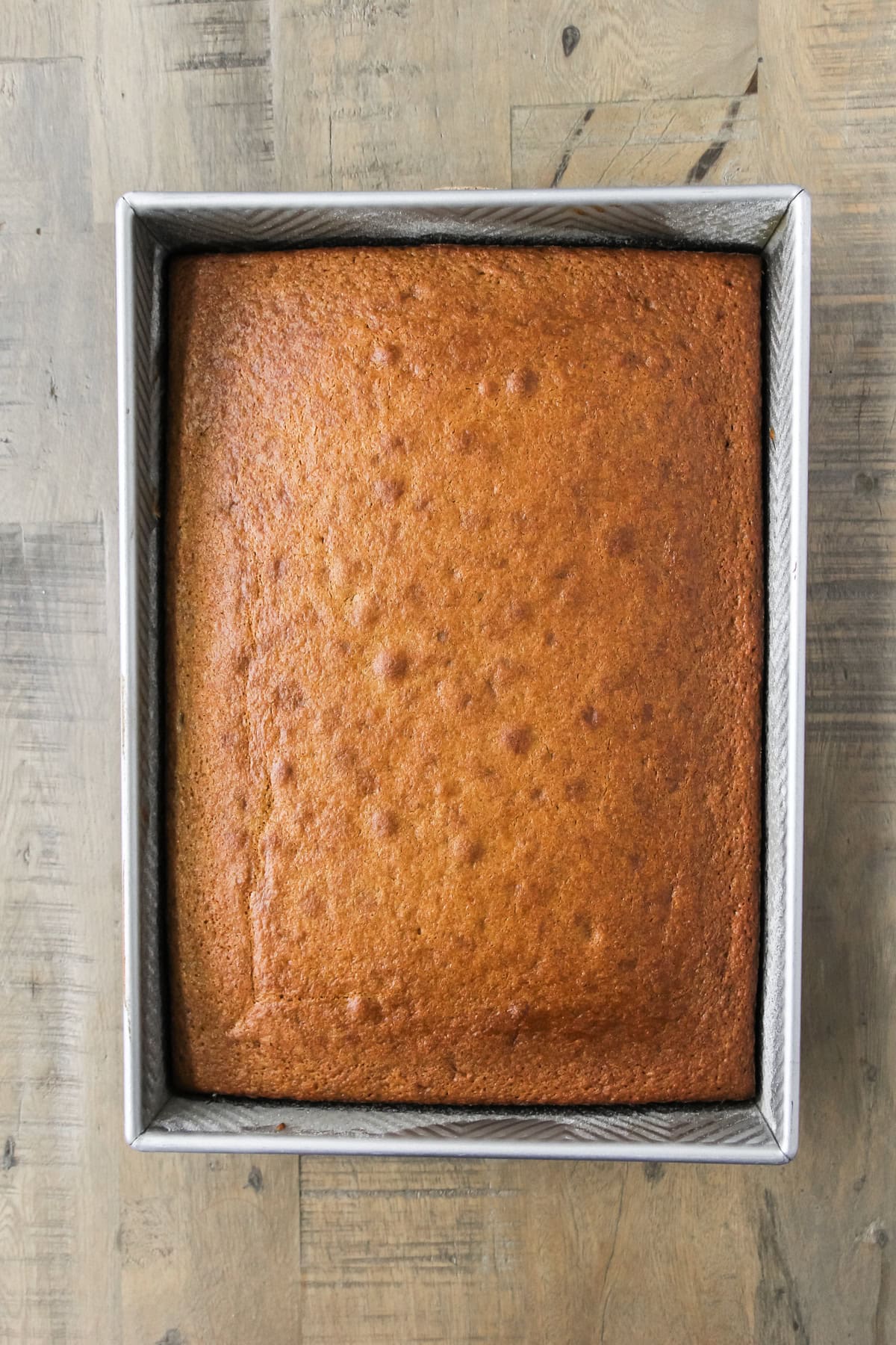 top down image a baking pan of baked spice cake