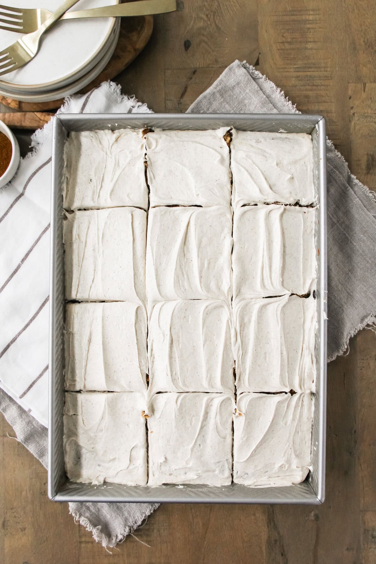 top down image a baking pan of frosted spice cake