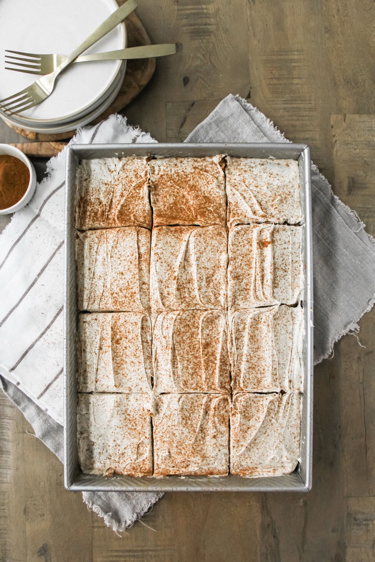 top down image a baking pan of frosted spice cake