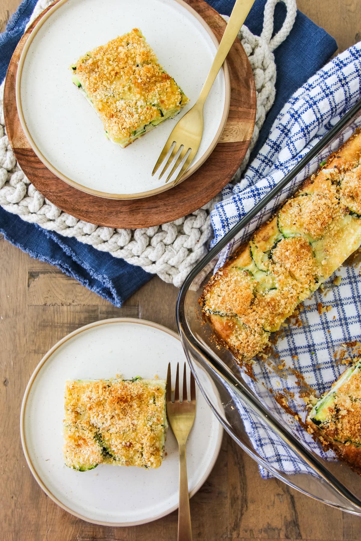 a top down image of two slices of crustless zucchini pie on plates