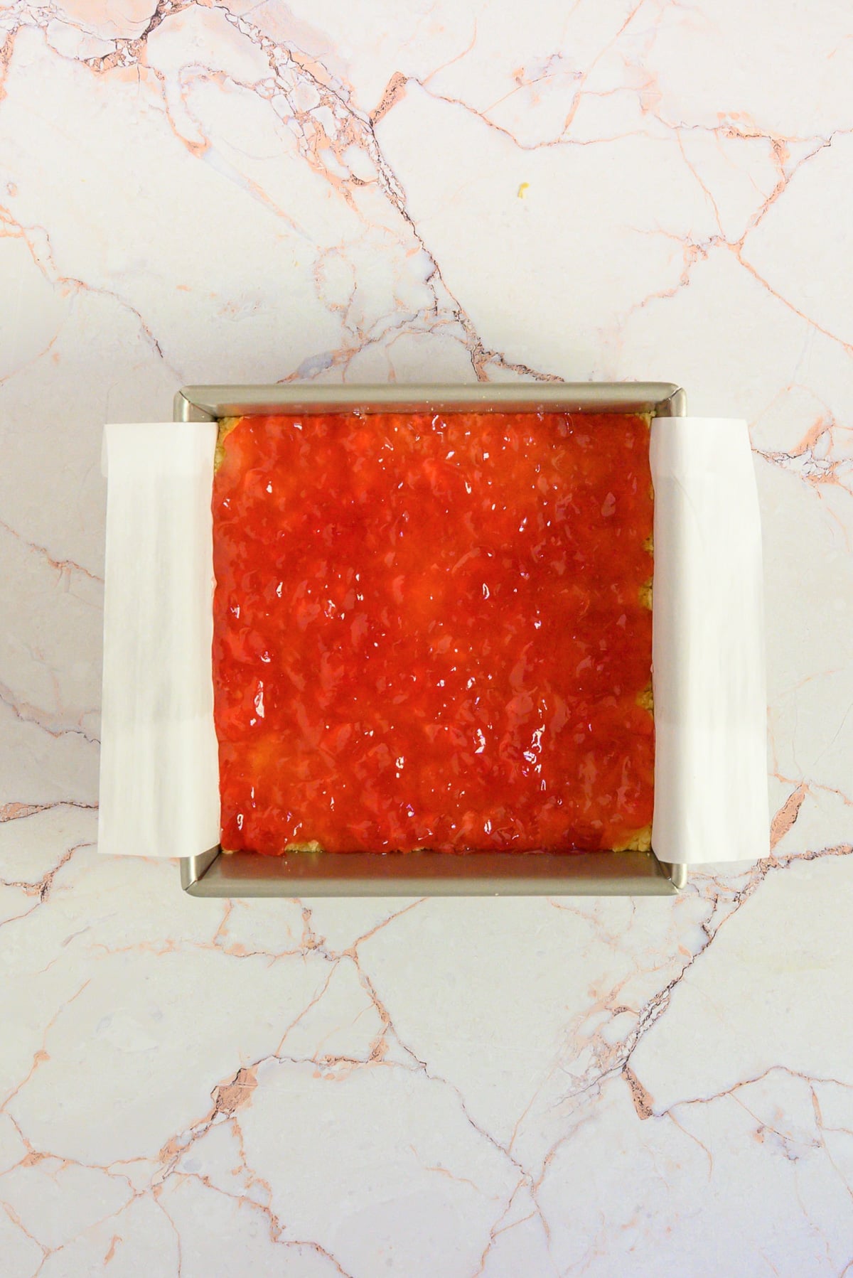 a top down image of Cheddar Cheese Shortbread with Apple Jelly in the baking pan
