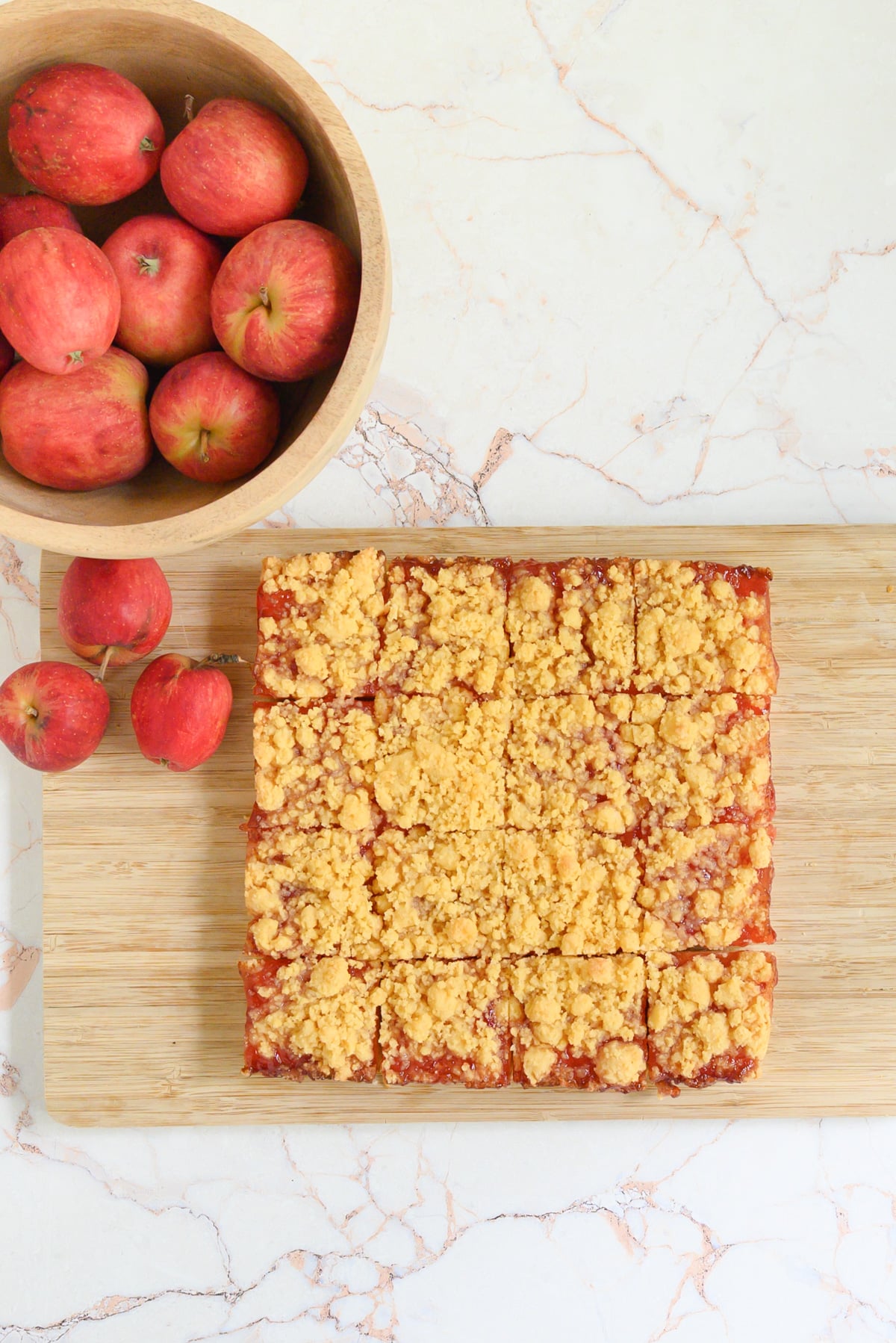 a top down image of cut squares of Cheddar Cheese Shortbread with Apple Jelly
