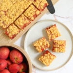 a top down image of cut squares of Cheddar Cheese Shortbread with Apple Jelly