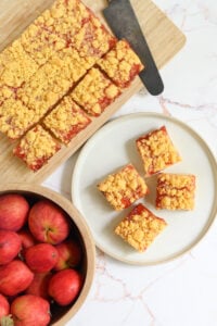 a top down image of cut squares of Cheddar Cheese Shortbread with Apple Jelly