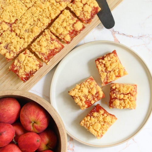 a top down image of cut squares of Cheddar Cheese Shortbread with Apple Jelly